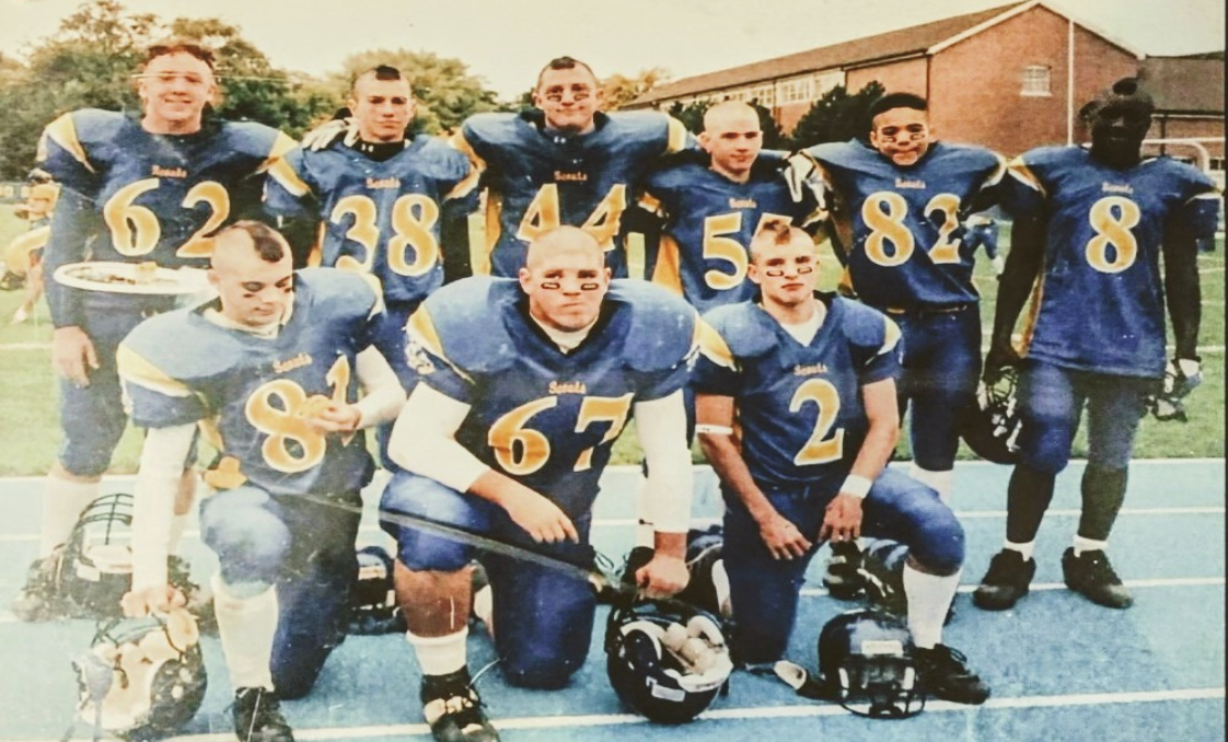 Image of the 2005 football team with the first team mohawks. Courtesy of Dylan Johnson